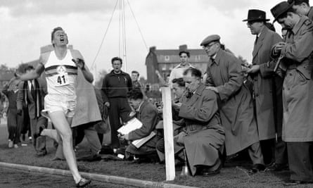 Roger Bannister completes his record-breaking run