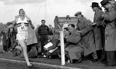 Roger Bannister hits the tape to become the first person to run a sub-four-minute mile, on 6 May 1954 in Oxford, England.