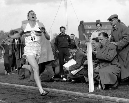 Roger Bannister crosses the line to complete the first ever sub-four minute mile in May 1954