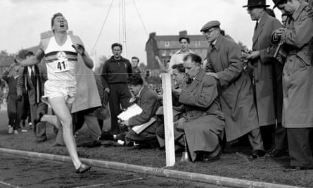 Roger Bannister hits the tape to become the first person to break the four-minute mile, on 6 May 1954 in Oxford