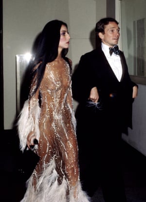 Mackie at the 1974 Met Gala, with Cher in the feathered ‘nude’ dress he created for her