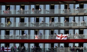 People watch the game from the balconies of a hotel overlooking Old Trafford.