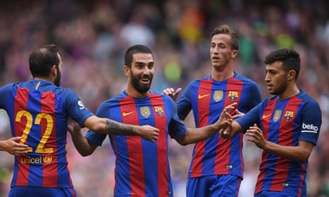 Arda Turan (second left) celebrates after opening the scoring against Celtic.
