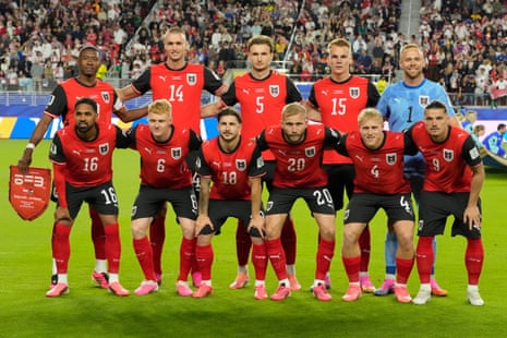 Austria players pose for a team photo ahead of the World Cup Group J soccer match