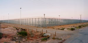 Welcome to Australia 2004. This photograph depicts the former Woomera Immigration Reception and Processing Centre in South Australia. In December 2004, Laing obtained permission to photograph the site, which had become controversial for the treatment of detainees. The year before, as a result of intense public pressure, the Australian government had closed the centre – it remained, however, a notorious place in the Australian consciousness. Laing states that the image represents ‘a wedge through the landscape – a blockage, an eyesore, an echo of controversy and a closing off in terms of both a view and a sense of possibilities of Australian identity’.
