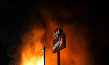 The Wendy’s restaurant where Rayshard Brooks was shot dead burns on Saturday.