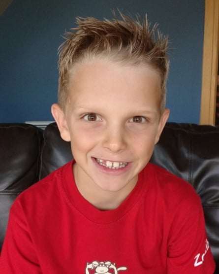 Jools wearing a red T-shirt.