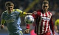 Astana’s Kazakh defender Evgeni Postnikov (L) vies for the ball with Atletico Madrid’s forward Fernando Torres during the UEFA Champions League group C football match between FC Astana and Club Atletico de Madrid at the Astana Arena stadium in Astana on November 3, 2015. AFP PHOTO / STANISLAV FILIPPOVSTANISLAV FILIPPOV/AFP/Getty Images