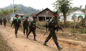 Kachin Independence Army (KIA) soldiers walk through Ka Htang Yang village in Kachin State.