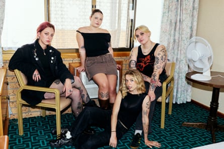 Teen Jesus and the Jean Teasers seated on chairs