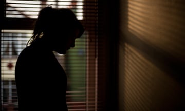 Silhouette of woman by a window