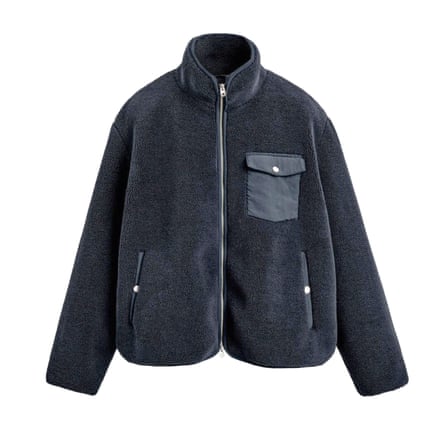 A short black fleecy jacket with a contrast pocket on a white background