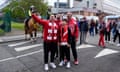Olympiakos fans take some pre-match pictures outside Villa Park.