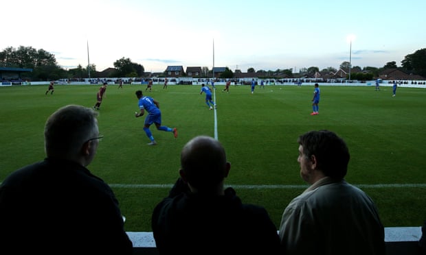 Fans watch a Bury AFC match at Stainton Park