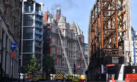 Firefighters tackle a blaze at the Mandarin Oriental hotel in central London.