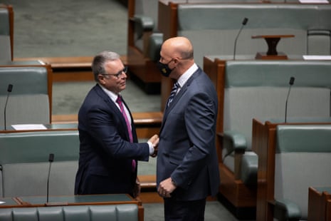 Labor MP Joel Fitzgibbon is congratulated by defence minister Peter Dutton after he delivered his valedictory speech.