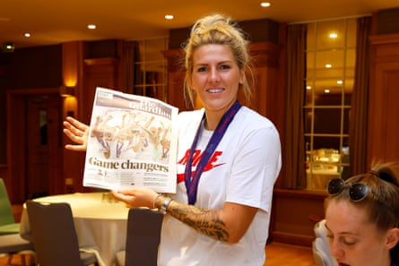 Millie Bright of England holds up the Guardian newspaper with the headline ‘Game changers’