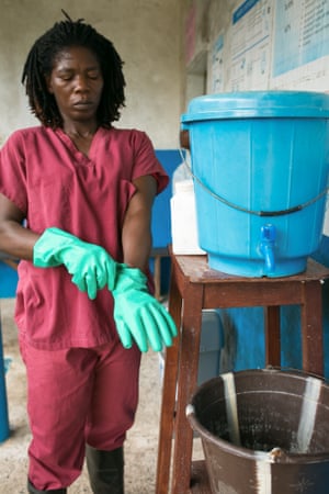 Yeartee Barteh, 39, a cleaner, prepares for work