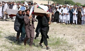 People attend the funeral of victims of a US drone strike in Khogyani district of Nangarhar province, Afghanistan, on 19 September.