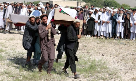People attend the funeral of victims of a US drone strike in Khogyani district of Nangarhar province, Afghanistan, on 19 September. 