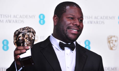 Steve McQueen holds his best film Oscar for 12 Years a Slave in 2014.