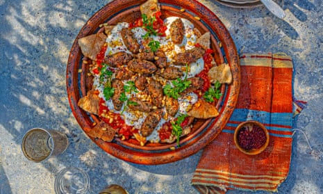 Kofte kebabs with tomato sauce and yoghurt.