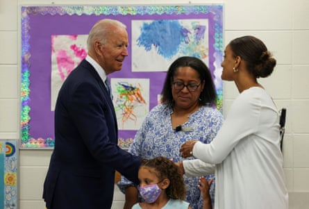 Joe Biden greets women, as he tours the Children’s Learning Center at McHenry County College during a visit to the north-west Chicago suburb Crystal Lake, Illinois, earlier this month.