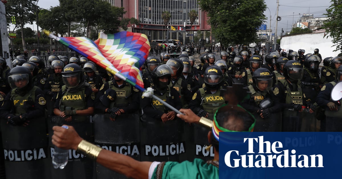 Dozens injured and police stations attacked as protests continue in Peru – The Guardian