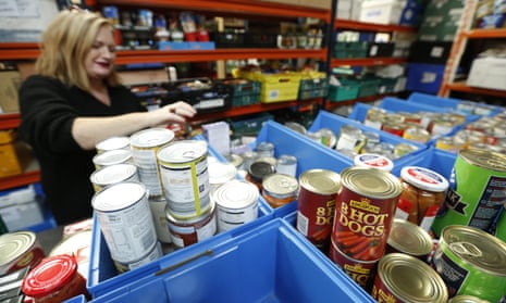 A volunteer at Loaves and Fishes food bank, East Kilbride, Glasgow, October 2021.