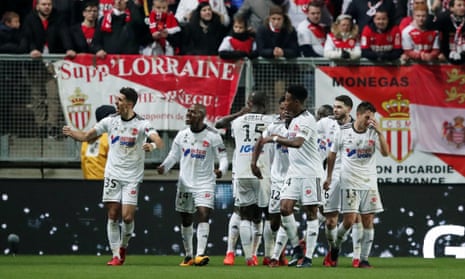 Amiens players celebrate after taking the lead against Monaco.