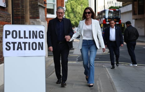 Keir Starmer and his wife Victoria arrive at a polling station in Westminster.
