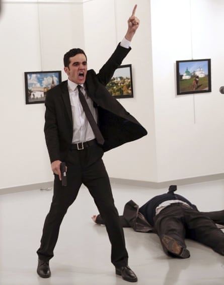 Mevlut Mert Altintas shouts after shooting Andrei Karlov, right, the Russian ambassador to Turkey, at an art gallery in Ankara, Turkey, 2017