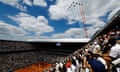 Alpha jets of the Patrouille de France fly over the stadium before the start of the men's singles final.