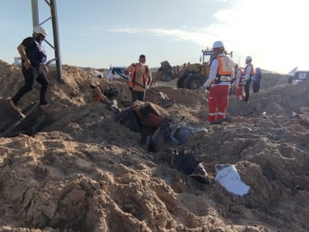 A Palestine Red Crescent Society team at the site of the attack.