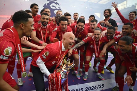 Arne Slot celebrates with the trophy after Liverpool won the Premier League