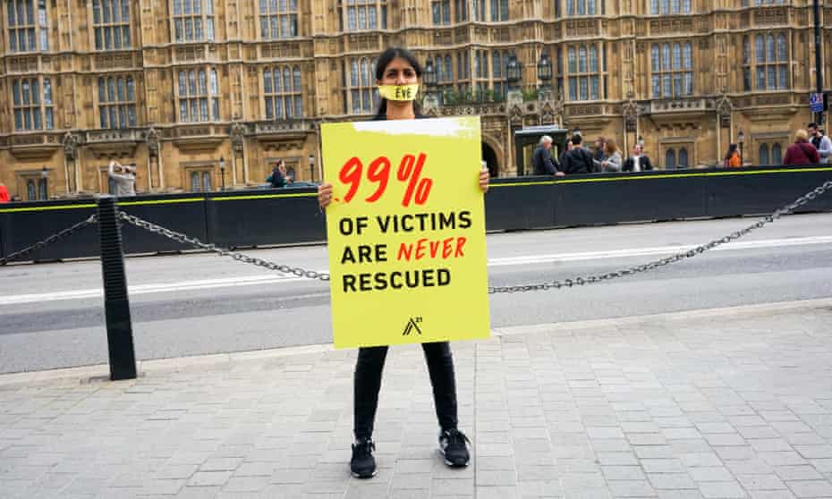 A protester against human trafficking outside parliament in London.