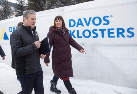 Britain’s Labour leader Starmer and the party’s financial chief Reeves walking to a meeting during the World Economic Forum in Davos today.
