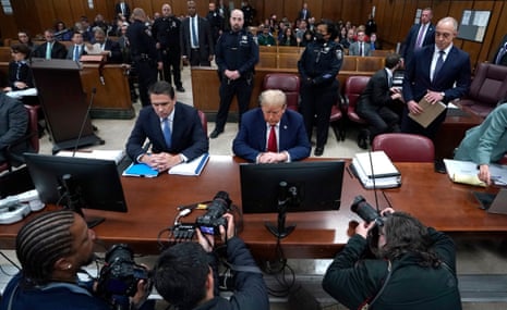 Donald Trump, with lawyer Todd Blanche (L), attends his trial for allegedly covering up hush money payments linked to extramarital affairs, at Manhattan Criminal Court in New York City on 23 April 2024.