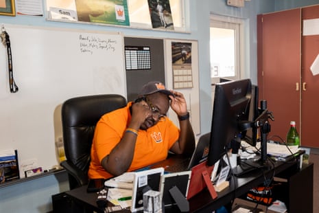 A man talking on the phone at his desk