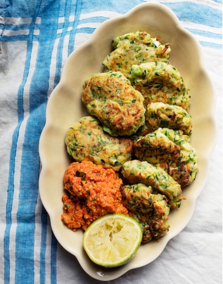 Courgette cakes with red pepper sauce.