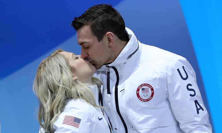 Chris and Alexa Scimeca Knierim celebrate their Olympic bronze medal with a kiss.