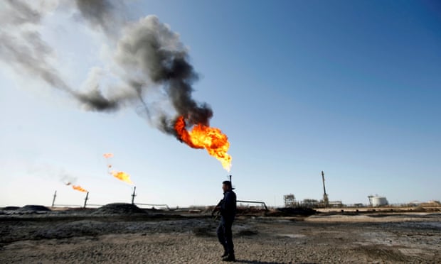 A policeman is seen at West Qurna-1 oil field, which is operated by ExxonMobil, in Basra, Iraq.