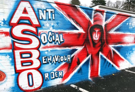 A graffiti mural with “anti social behaviour order” and an illustration of a mean-looking boy in a hoodie