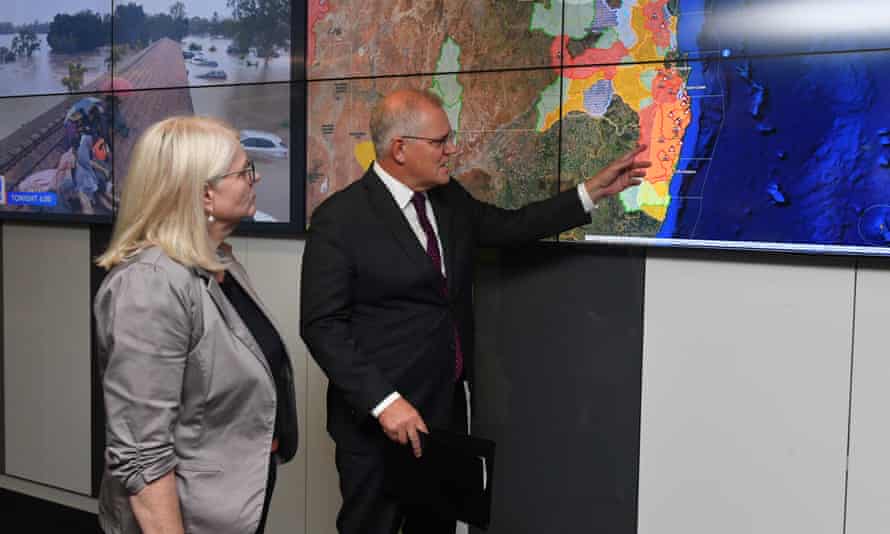 Home affairs minister Karen Andrews and prime minister Scott Morrison are briefed on the flooding disaster in Canberra.