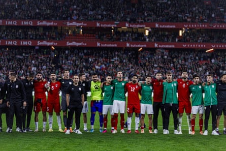 The players from both teams salute the crowd at full-time.
