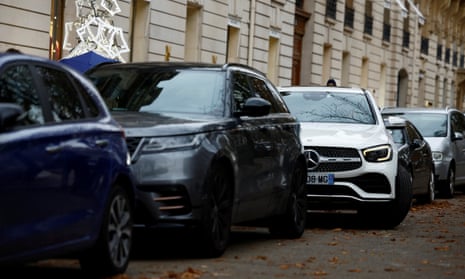 SUV cars parked on a street in Paris