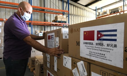 A worker transports medical supplies donated to Cuba from China.