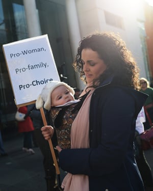 A mother and her baby protest alongside fellow pro-choice supporters outside the Public Prosecution Office in Belfast.