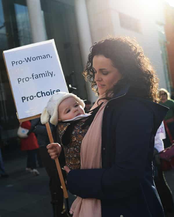 A mother and her baby protest alongside fellow pro-choice supporters outside the Public Prosecution Office in Belfast.