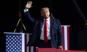 Donald Trump waves at the end of a campaign rally in Gastonia, North Carolina, on 21 October.